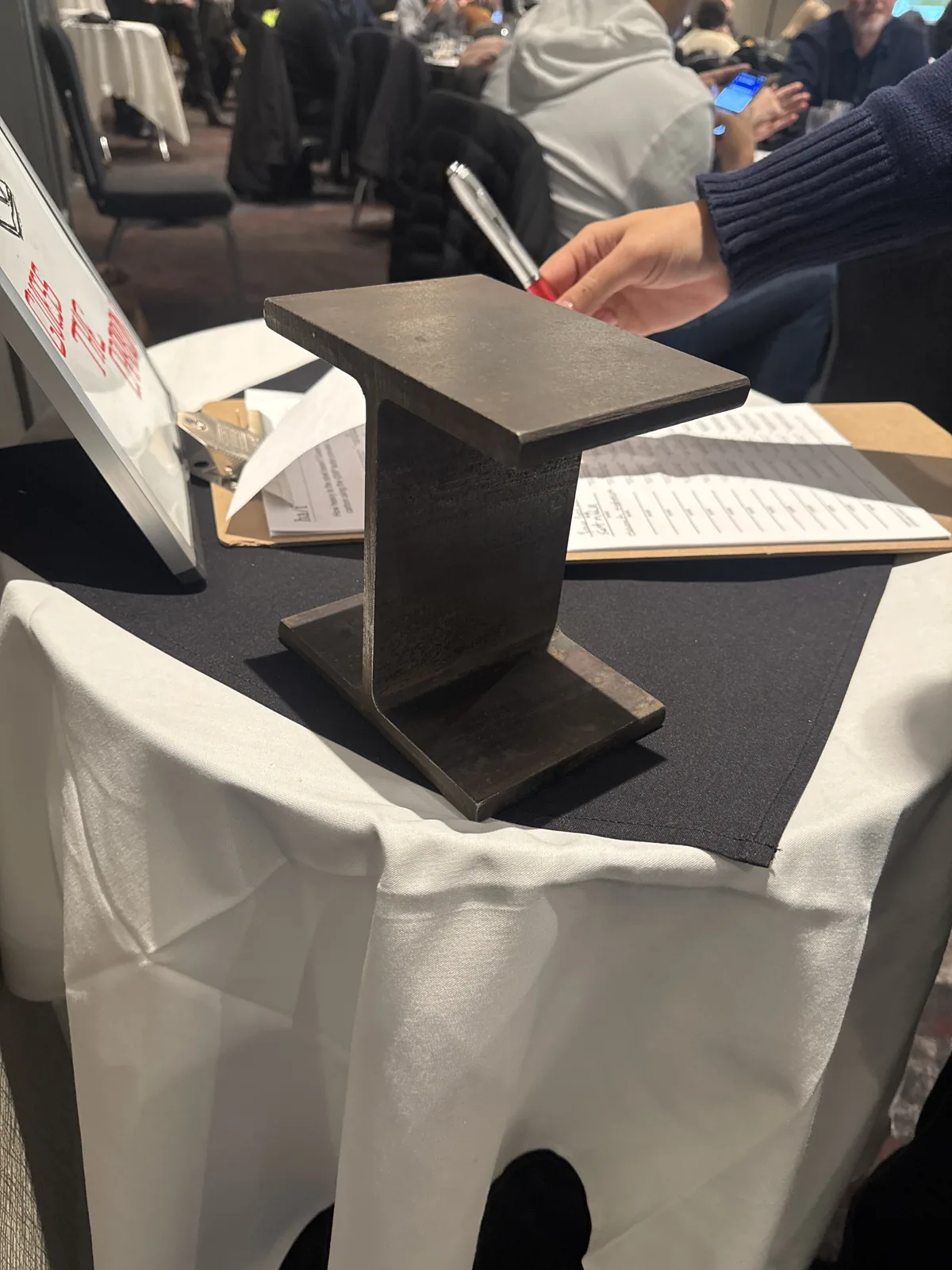 A short length of steel I-beam standing on a workshop table at the Whole Building Life Cycle Assessment Workshop